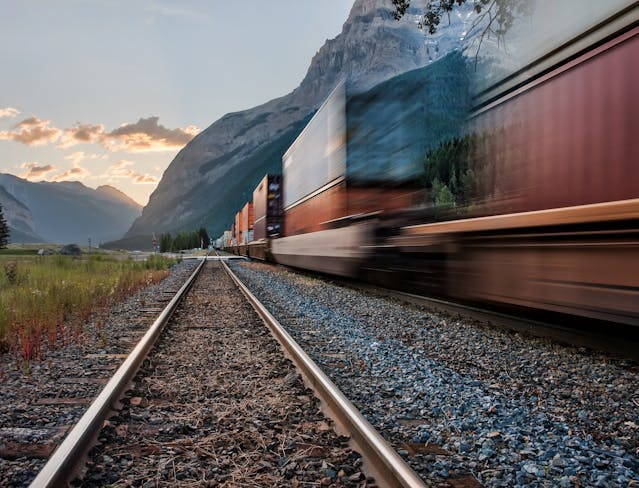 train going through mountains