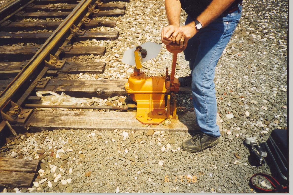 person using a railroad switch